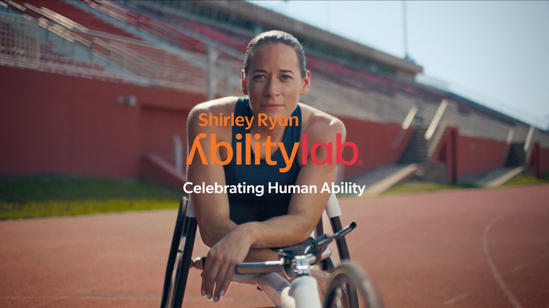 Paralympian Kelsey LeFevour racing in a track wheelchair